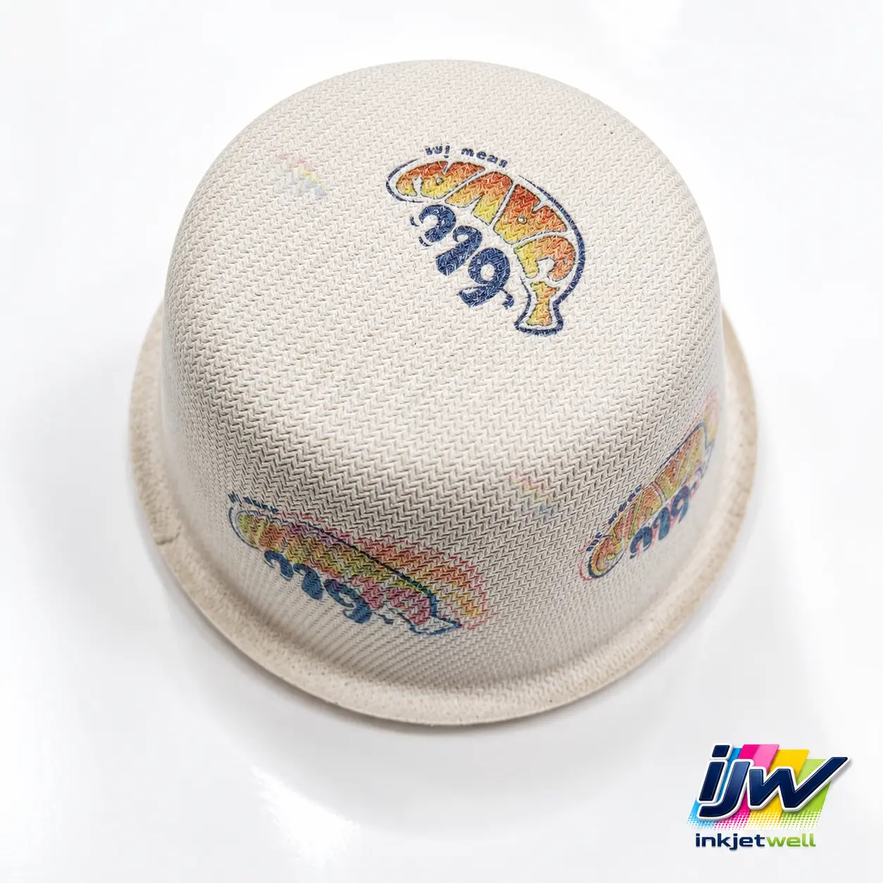 Repeated color graphics printed on a three-dimensional textured nonwoven sample